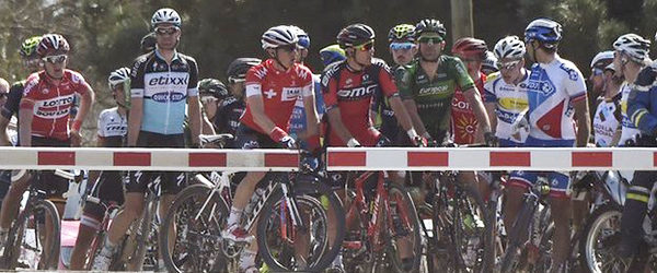 Rider wait at level crossing